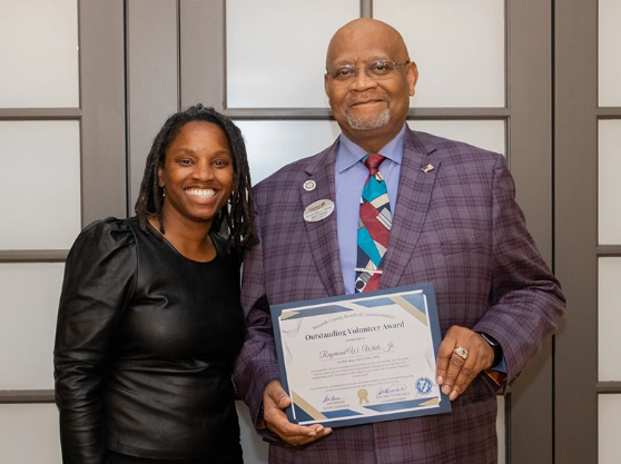 Raymond White Jr. receiving the District 8 Outstanding Volunteer Award